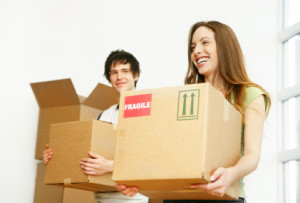 Photo Of A Couple With Boxes - Fidishun Insurance and Financial